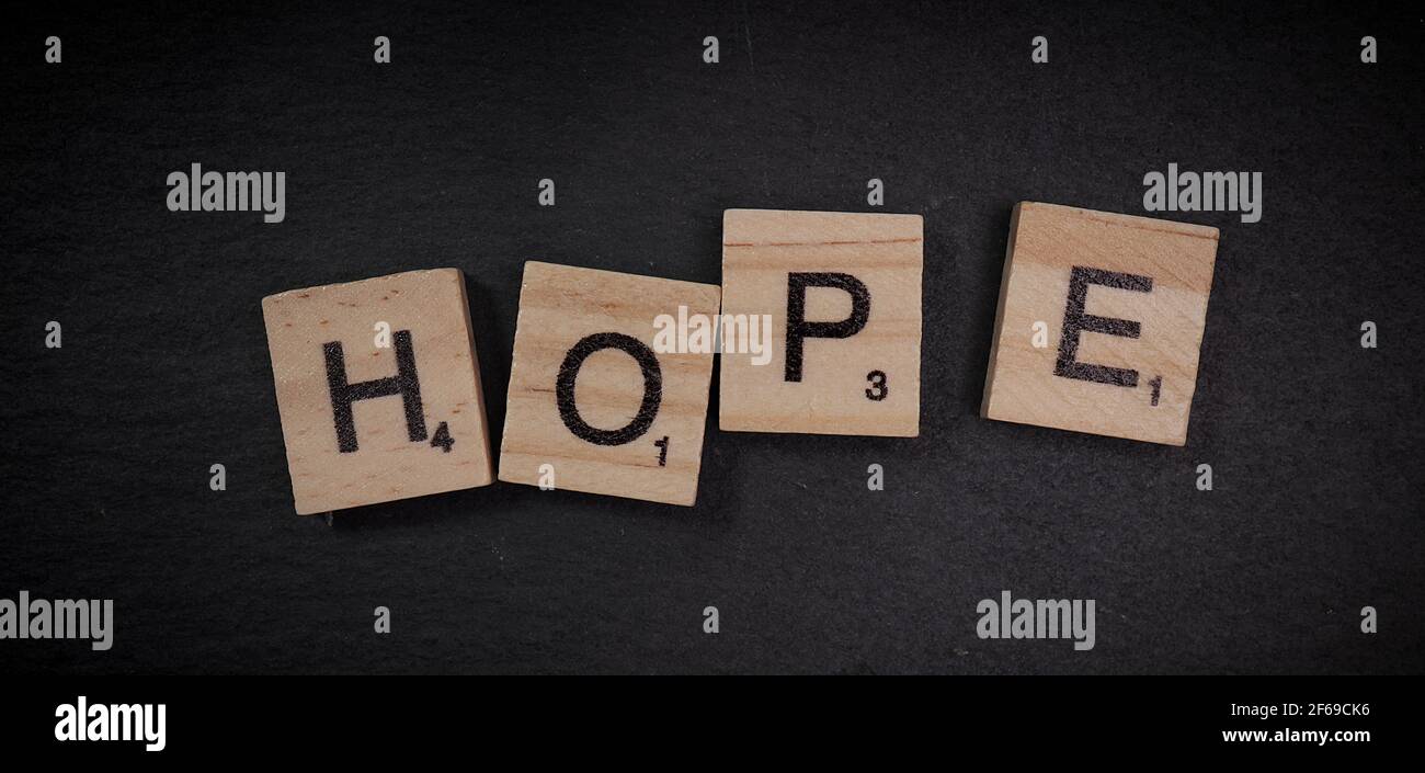 Writing the word Hope with wooden letters Stock Photo - Alamy