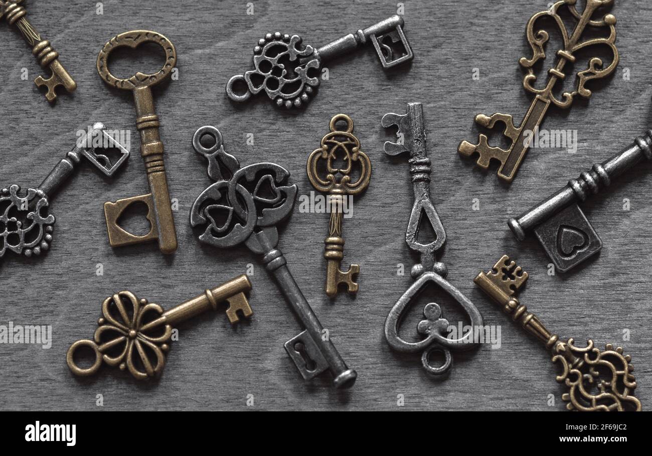 Retro keys collection on old wooden background Stock Photo