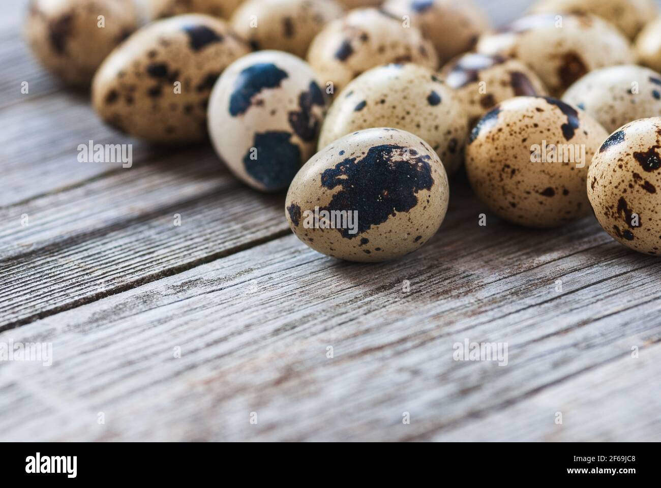 Quail eggs on old wooden table Stock Photo