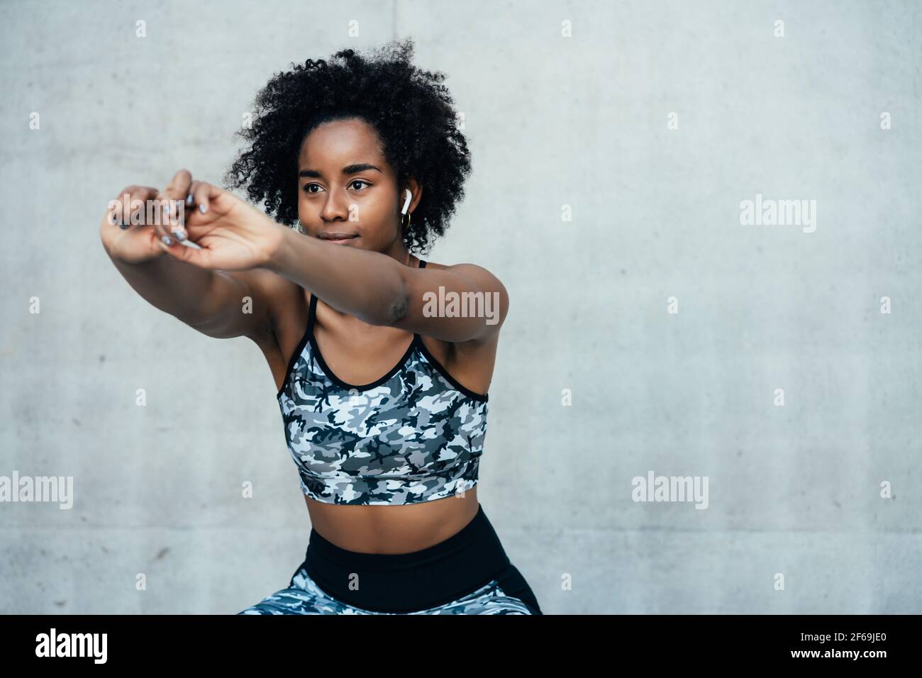 Afro Athletic Woman Stretching Arms Before Exercise Stock Photo Alamy