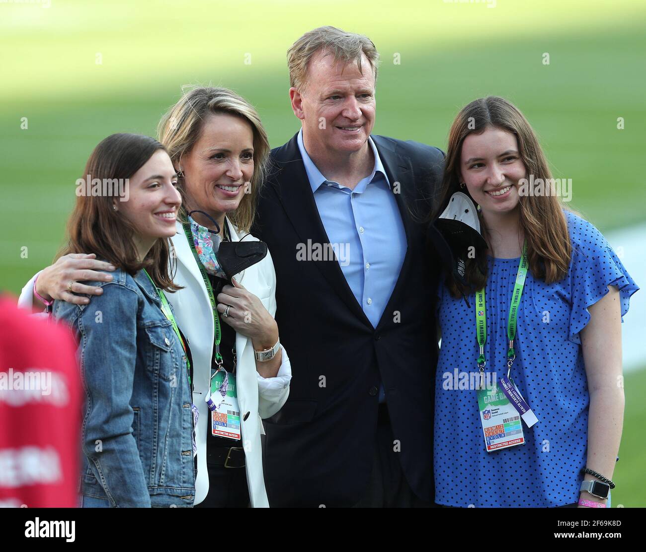 NFL Commissioner Roger Goodell, second from right, is joined by Terrell  Owens, right, New York Jets owner Woody Johnson, second from left, and  Johnson's wife Suzanne, center left, as he cuts the