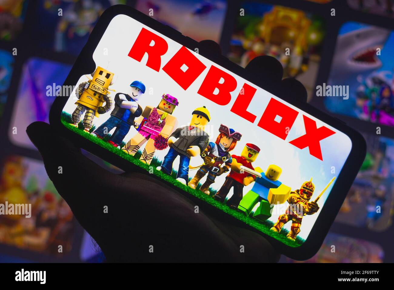 Cali, Colombia - August 15, 2021: Roblox logo on PC screen with keyboard,  mouse and speakers. Roblox is an online game platform and game creation  system. Stock Photo
