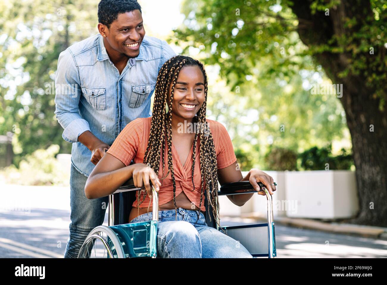 Woman in a wheelchair enjoying a walk with her boyfriend Stock Photo ...