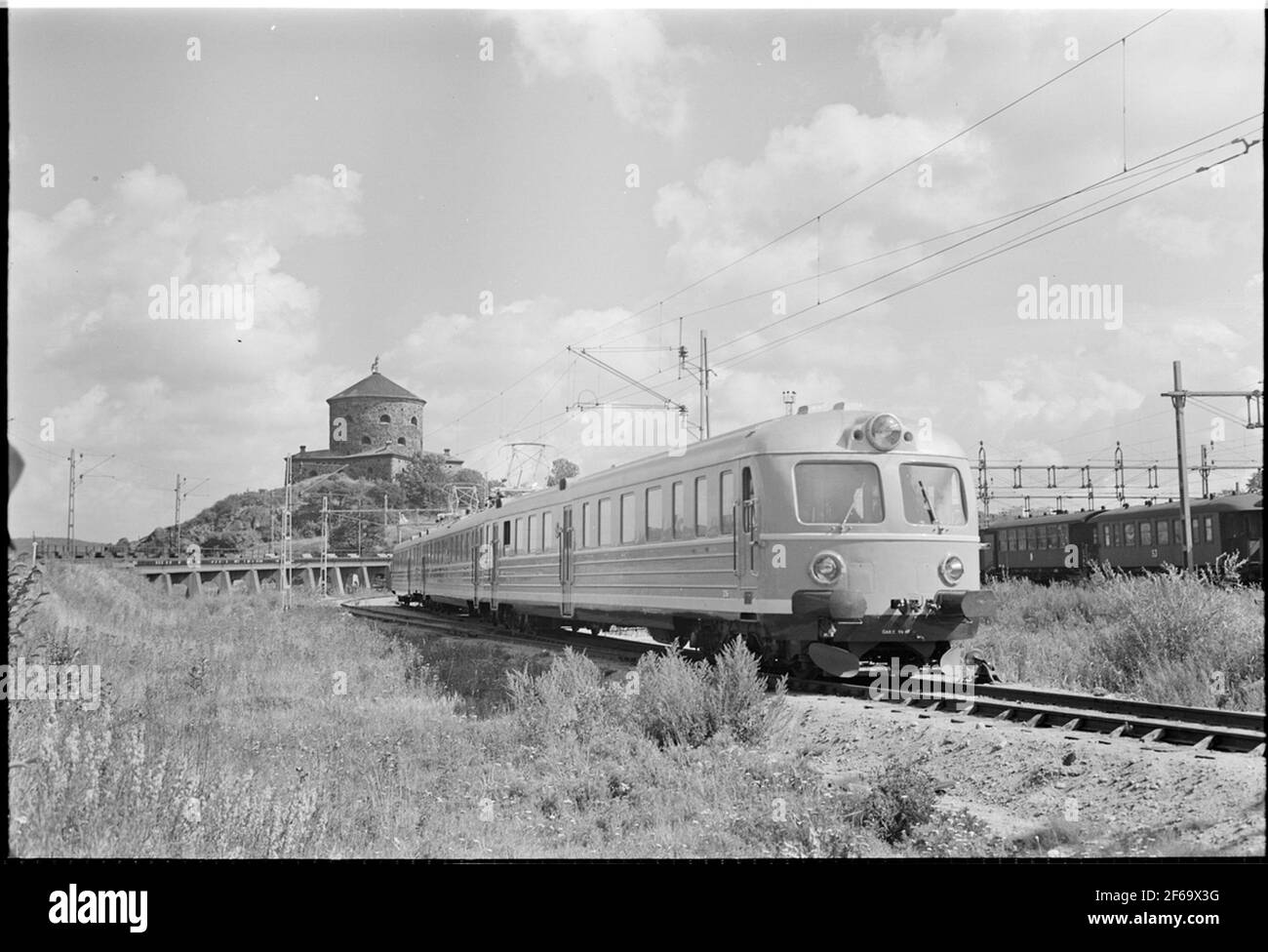 National railways, SJ XOA5 and SJ Creditor in Gothenburg. Skansen The lion is visible in the background. Stock Photo