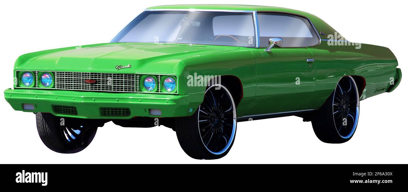 Custom 1971 Chevy Impala with bright green paint job and big tires. Stock Photo