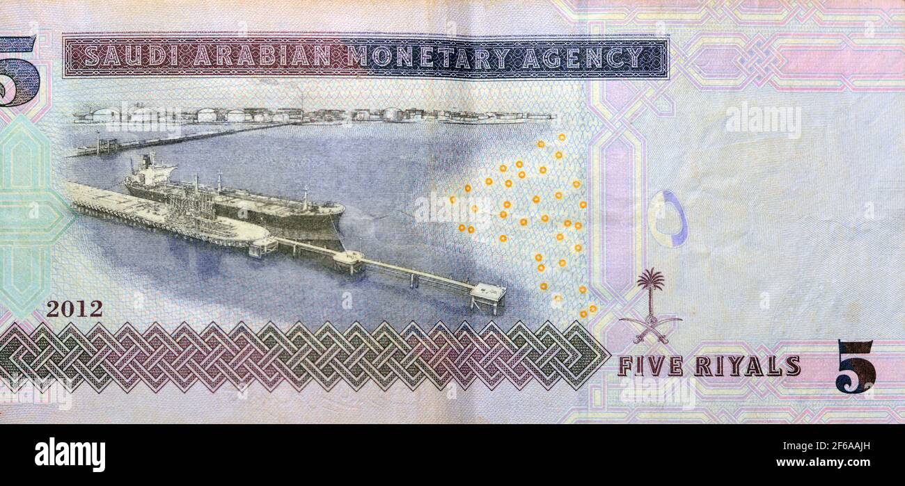 Saudi Arabia 5 riyals money background with the photo of king Abdullah ...