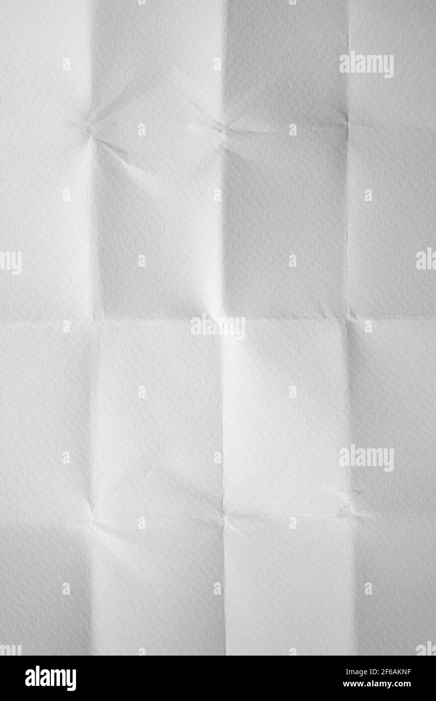 Unfolded folded white paper background in vertical Stock Photo