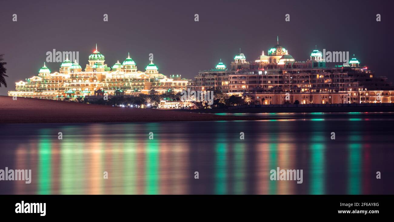 The beautifully illuminated Emerald Palace Kempinski hotel at night ...