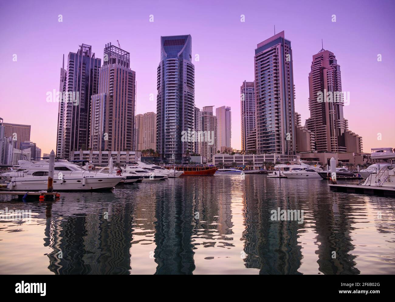 Beautiful sky scrappers, apartments, cruise ship deck and  hotels captured during the evening sunset time from the Marina mall Dubai Marina Promenade. Stock Photo