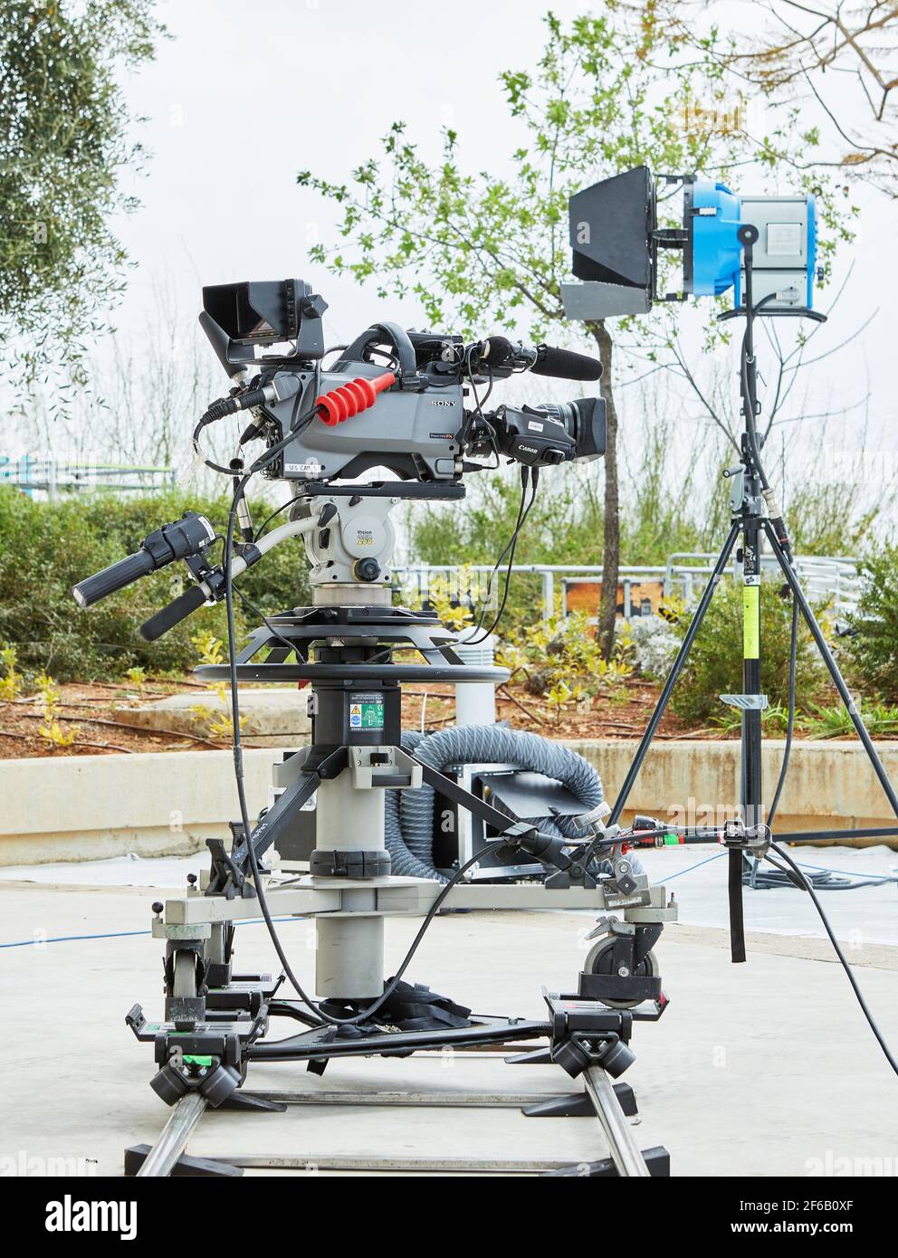 Professional equipment for filming TV shows and films. A video camera on  stand and lighting device Stock Photo - Alamy