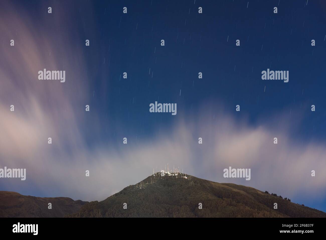 Long exposure of the Pichincha volcano with star trails at night, Quito, Ecuador. Stock Photo