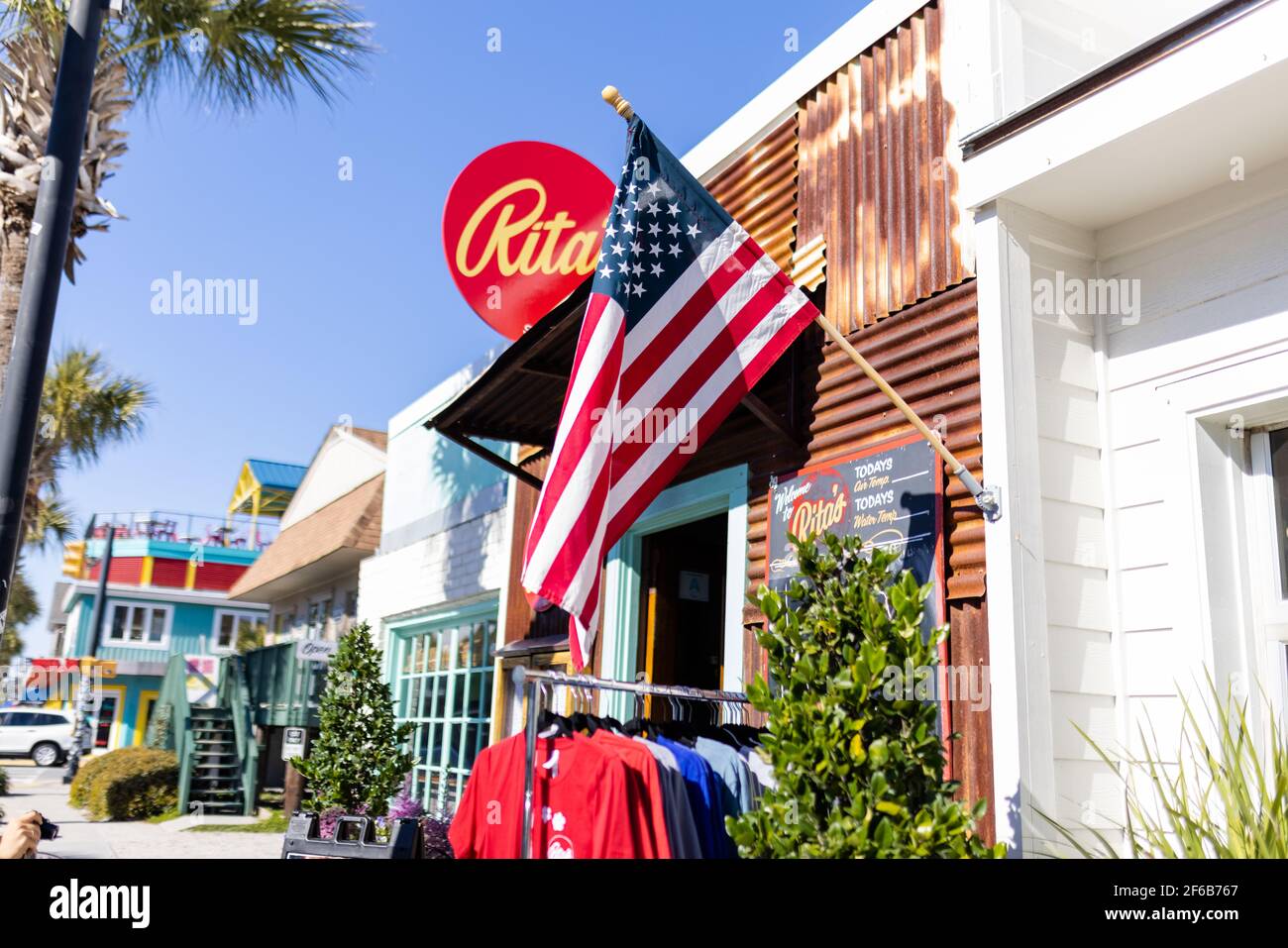 American flag hanging outside a restaurant with corrugated metal walls