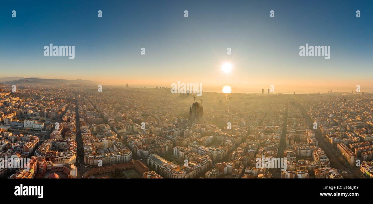 Aerial panorama shot of skyline in Barcelona center in foggy sunrise in Spain winter Stock Photo