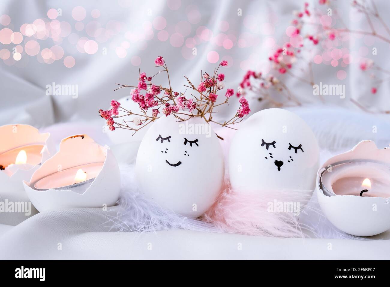 Minimal easter concept. Easter eggs with painted smiley faces and bird  feather on pastel background. Wedding couple eggs. Married. Valentines day  Stock Photo - Alamy, image size:1300x956