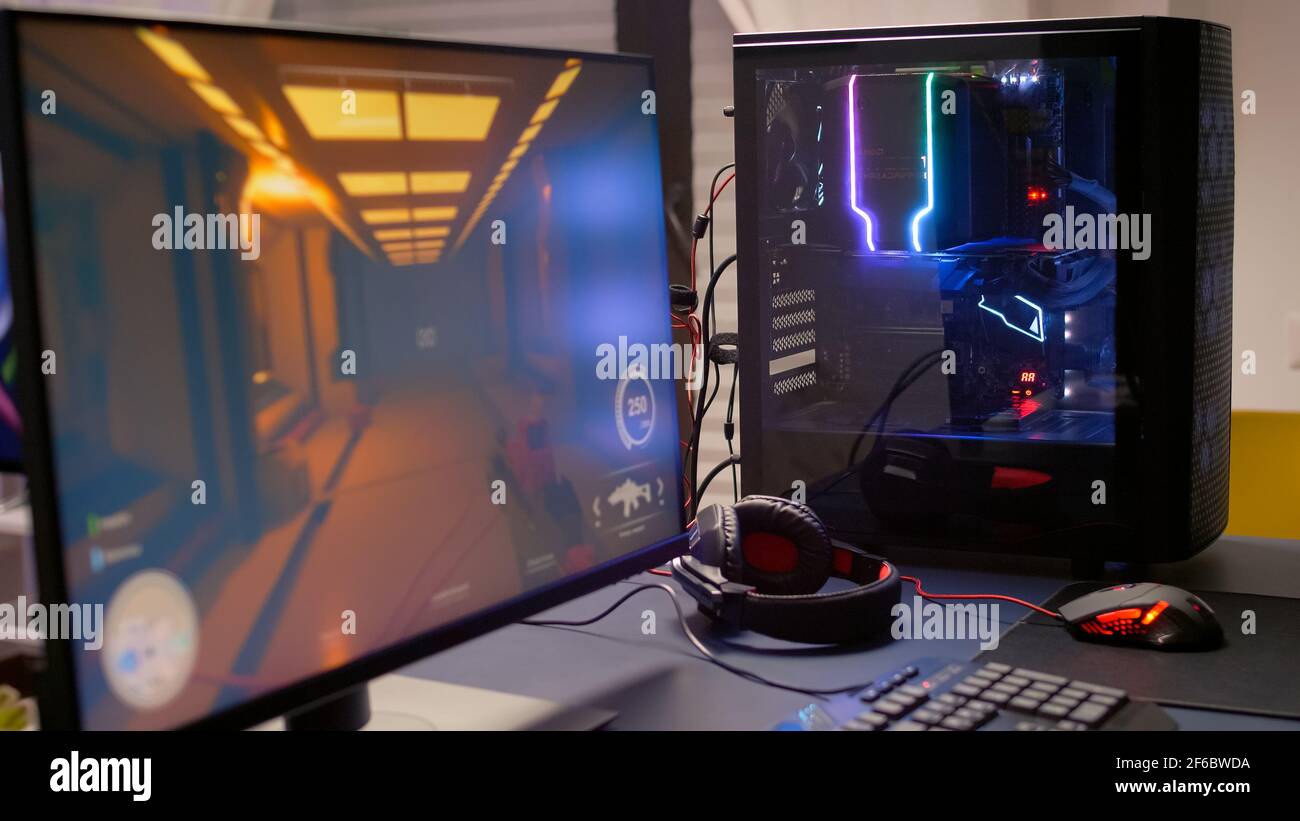 Close-up of professional monitor with first person shooter video game on.  Home studio of esport video game player using powerful gaming computer  during online competition Stock Photo - Alamy