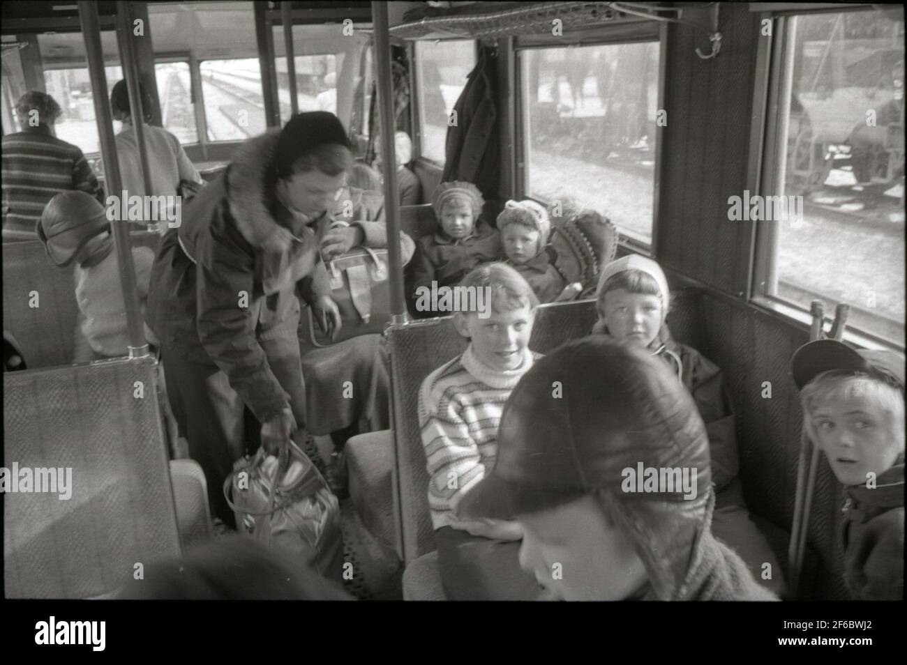 The rail bus between Abisko and the Riksgränsen on the Malmbanan. Girl in bright striped margaret Johansson. To the right of her kajsa haapala. Stock Photo