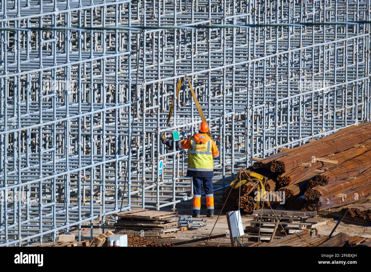 Unrecognizable builder working with metal construction Stock Photo
