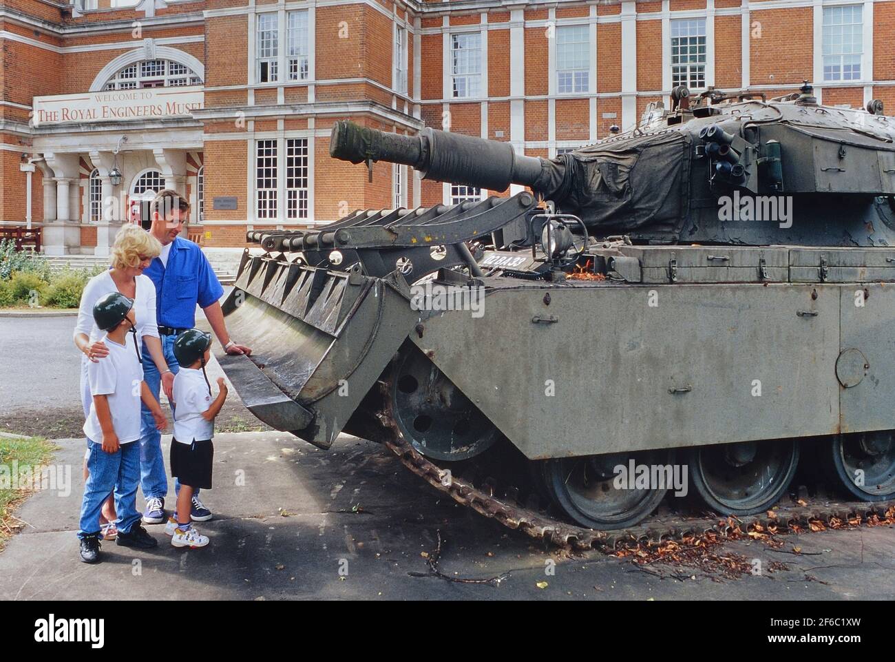 A family looking at a Centurion AVRE tank outside The Royal Engineers Museum, Library and Archive, Gillingham, Kent, England, UK Stock Photo
