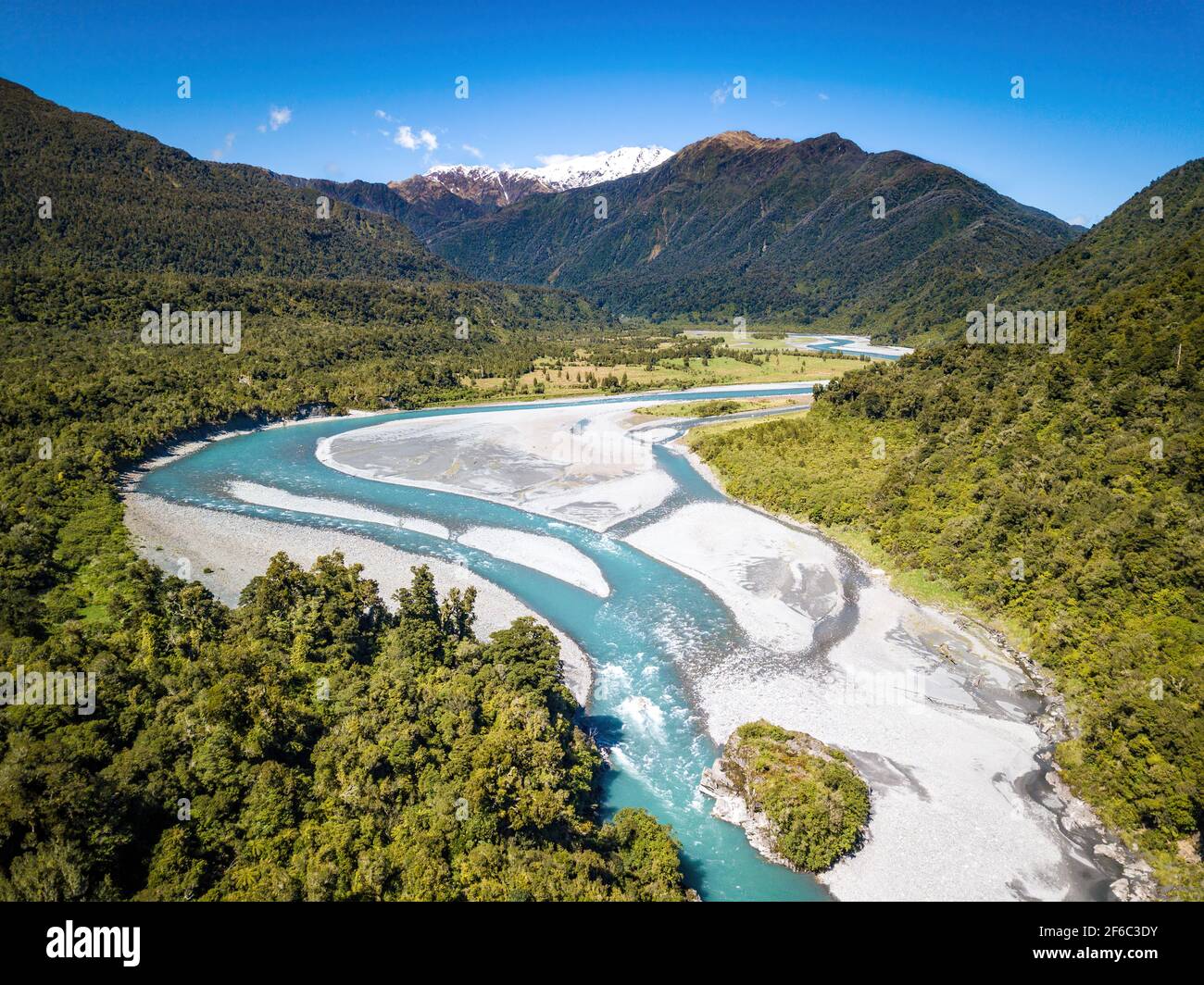 Turquoise river flow in turning river divided into several streams. Aerial view of New Zealand fantastic landscapes and scenery. Stock Photo