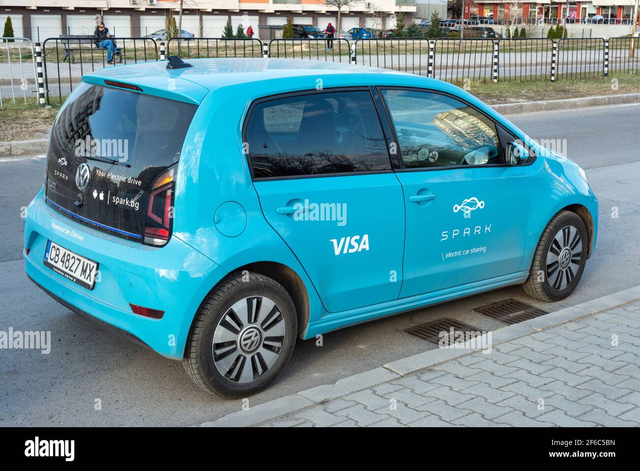 Volkswagen e-Up! for Spark Electric Car Sharing scheme parked on residential area neighbourhood street in Sofia, Bulgaria, Eastern Europe, EU Stock Photo