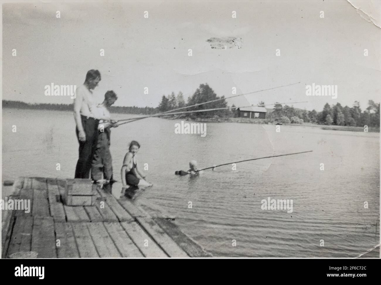 Långsjö-Pelle Metar from the dock. On the north side of the lake, the Toret Engvalls appears. Stock Photo