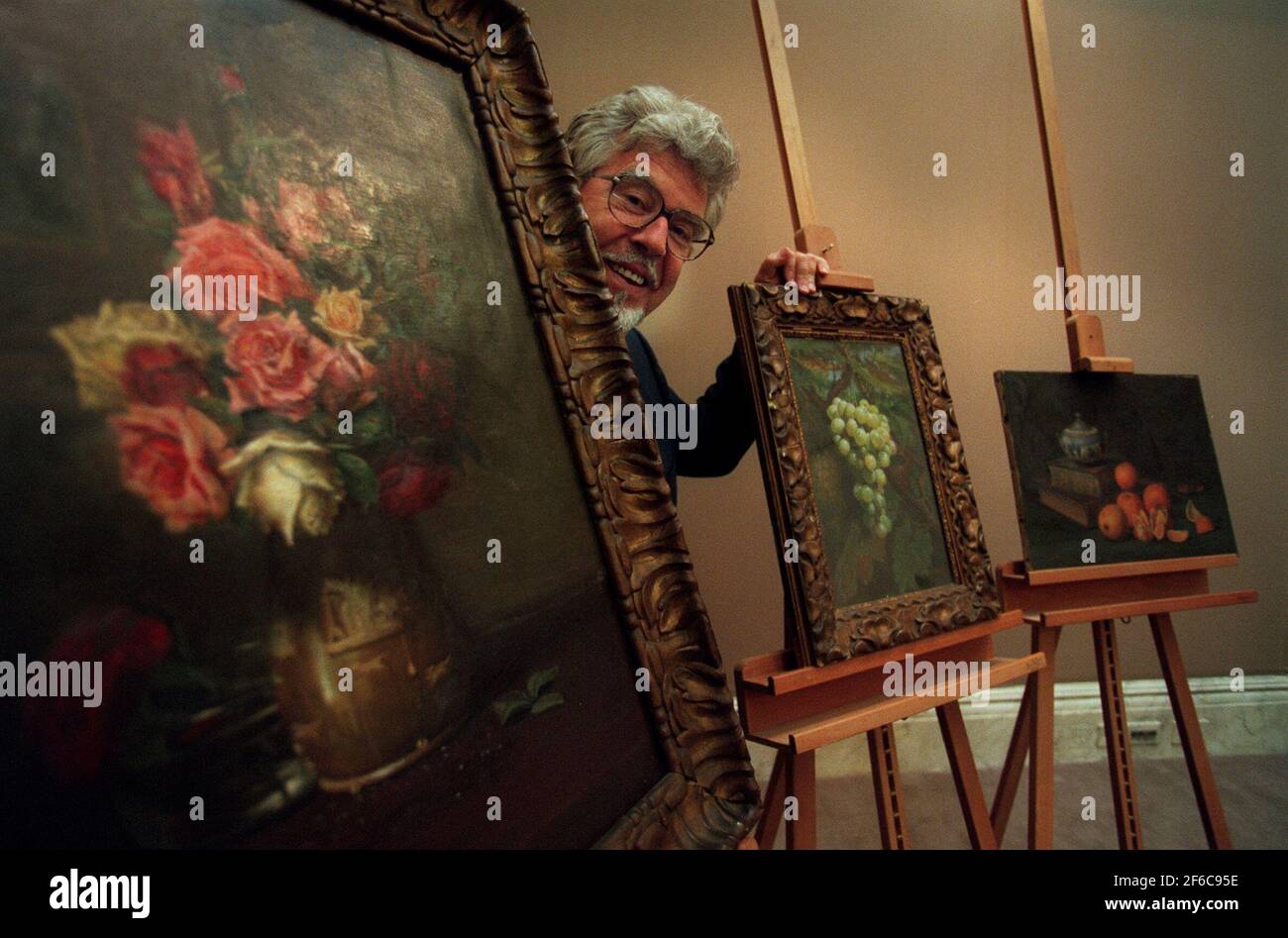 Rolf Harris with his grandfathers paintings Stock Photo Alamy
