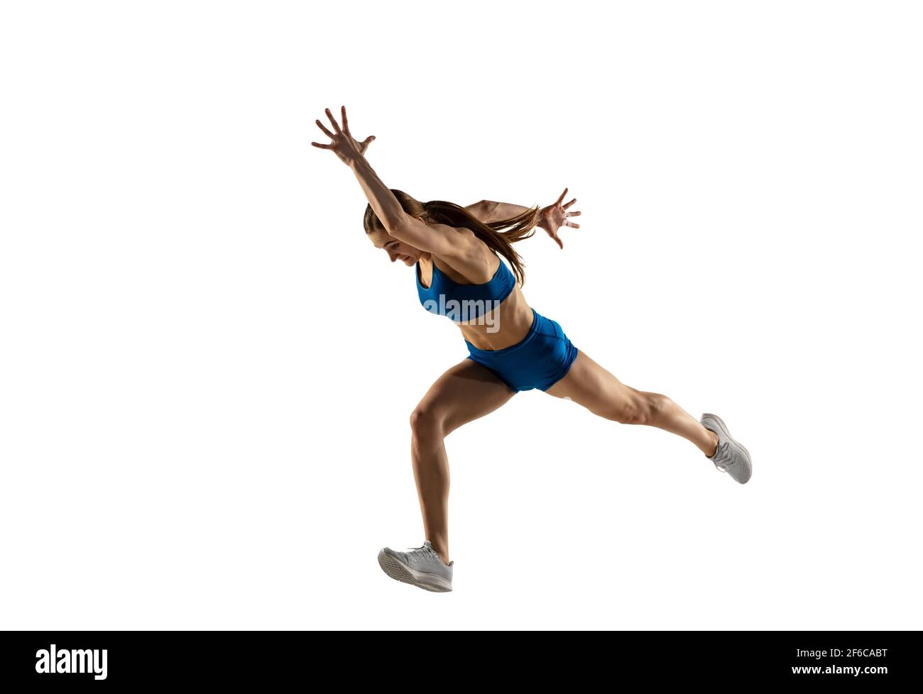 Beautiful woman, track athlete training isolated over white studio