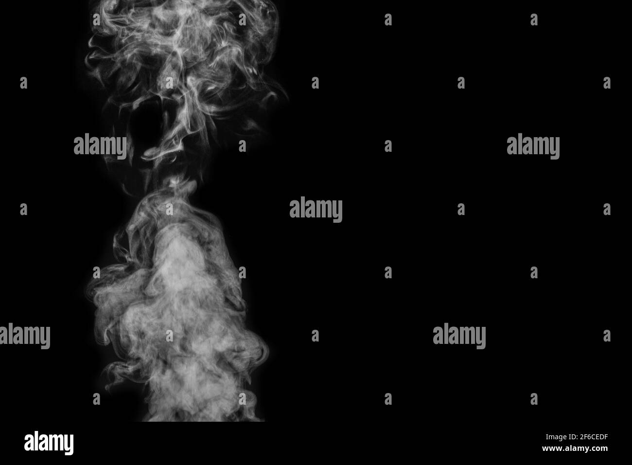 Figured smoke on a dark background. Abstract background, design element. Stock Photo