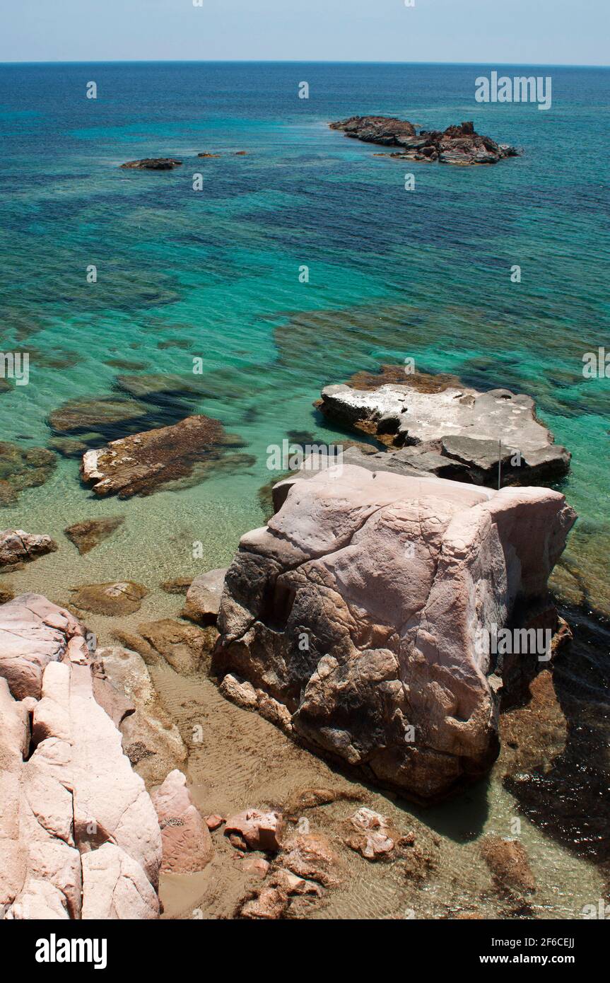 crystal clear water, white sand and colored rocks in Genio beach, Carloforte, St Pietro Island, Sardinia, Italy, Europe Stock Photo