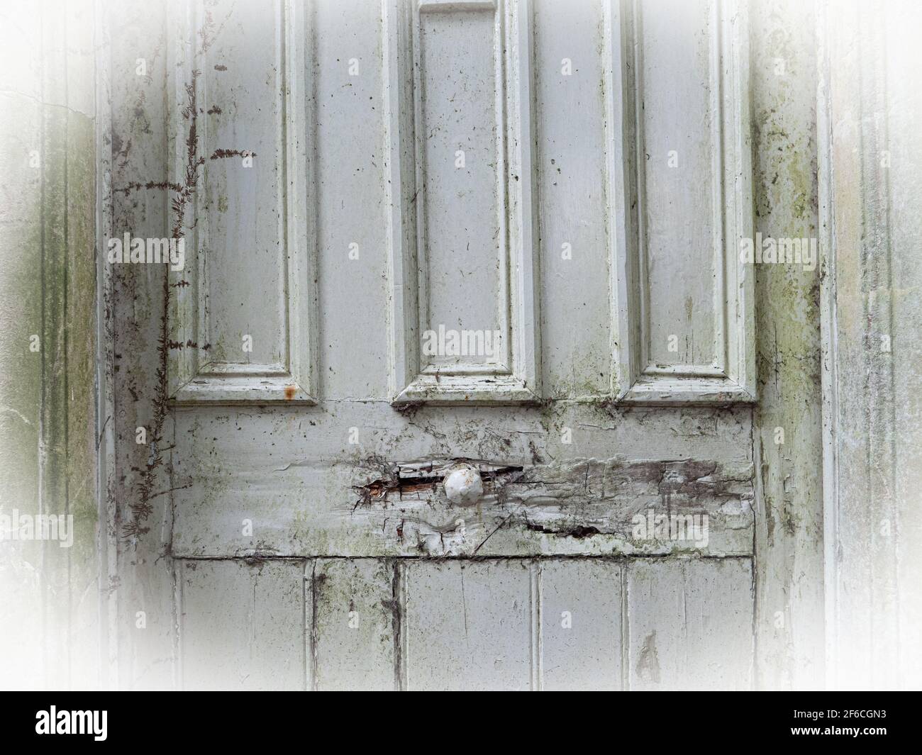 An old door in very poor condition in Penleigh, Westbury, Wiltshire, England, UK. Stock Photo