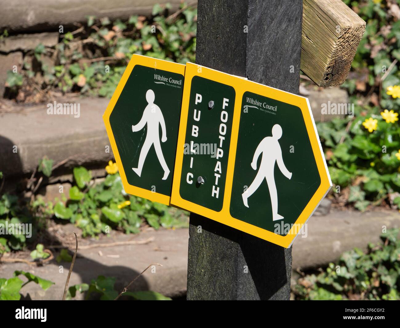 Public footpath sign by steps at Penleigh, Westbury, Wiltshire, England, UK. Stock Photo