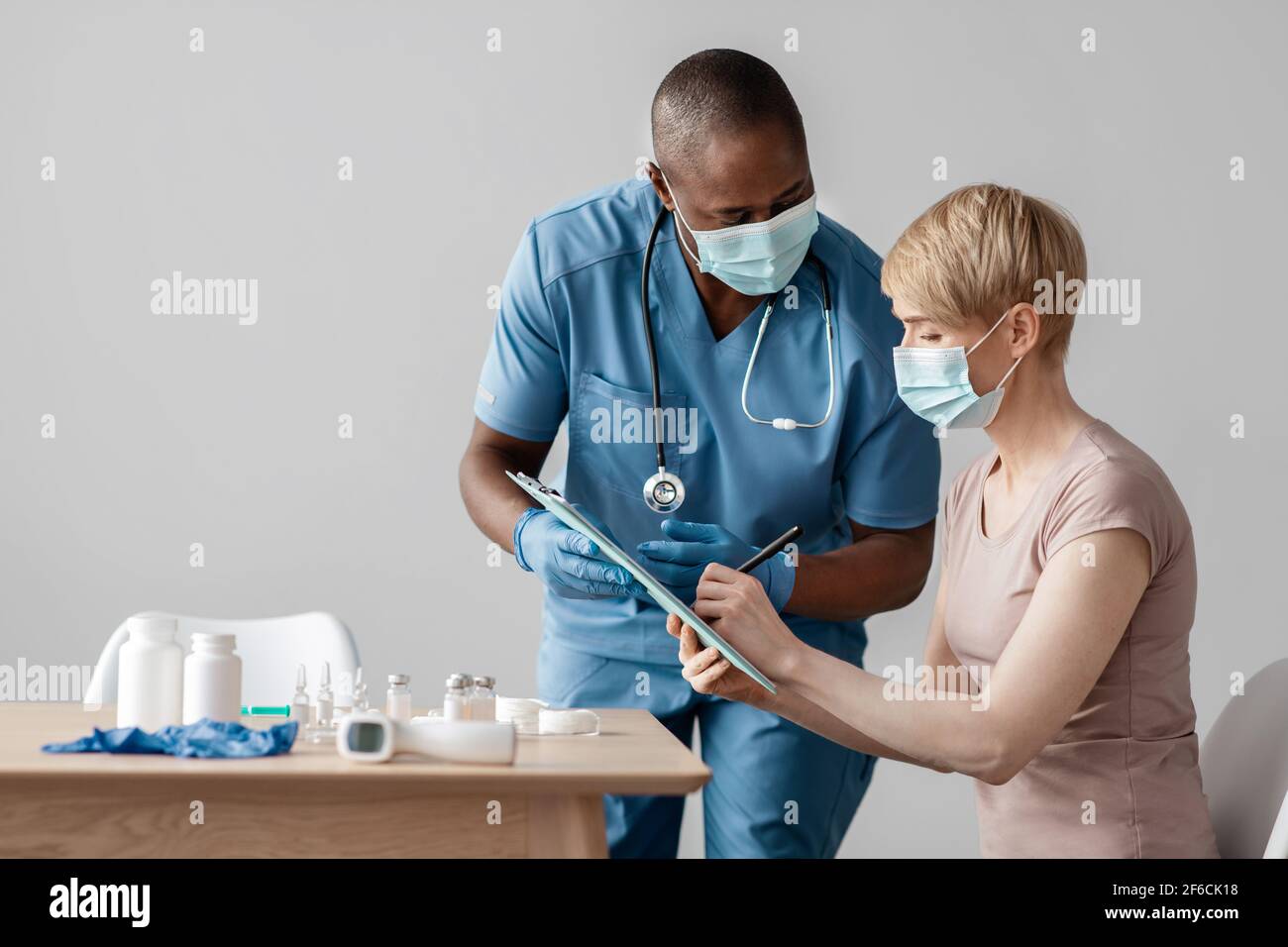 Caring for patients and preparing for vaccination against influenza Stock Photo