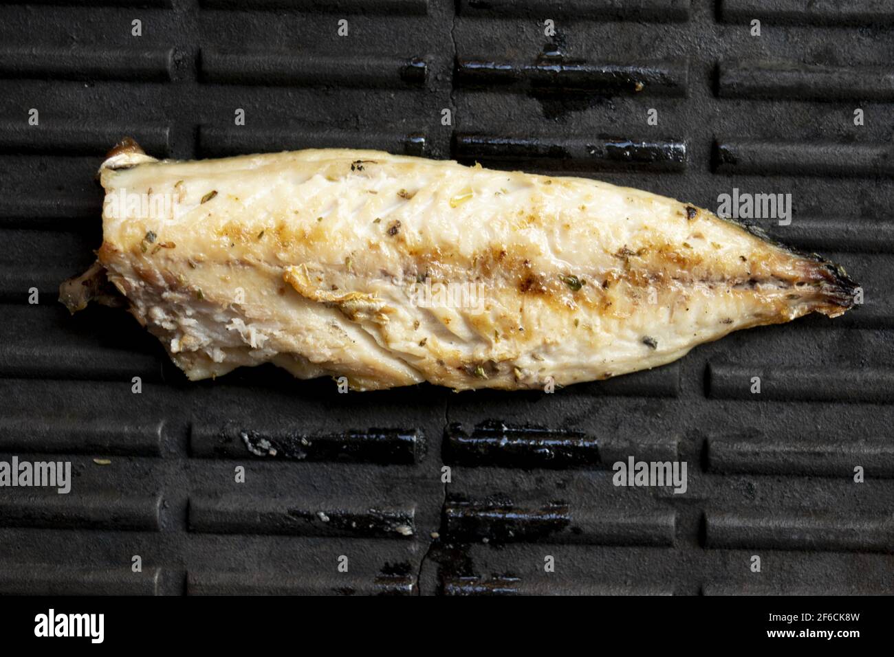 a griddle during the cooking of a fresh mackerel fillet Stock Photo Alamy