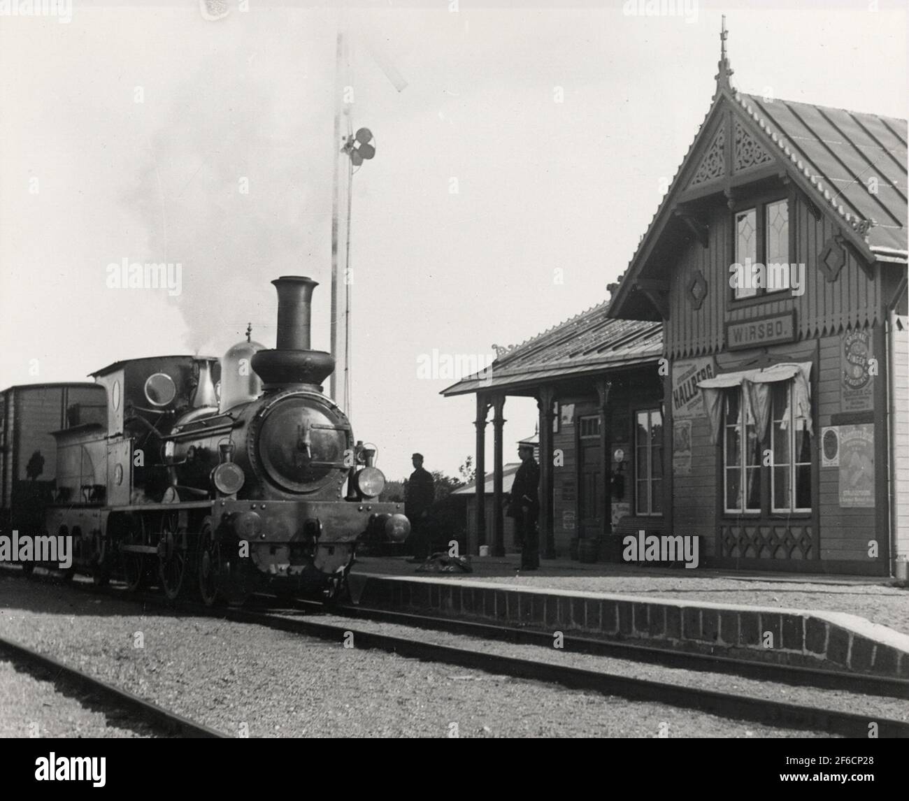 SWB A 4 at Virsbo Station. In service 1873-1924 F.D. Sala-toberg rail no. 2. Manufacturing NR 2349 Firma Sharp, Stewart & Co in Manchester. No. 4 Got new boiler 1914. The station maker is Gustaf Alfred Fors born 17/1 1857. The man on the left is station Karl No. 252 Oskar Larsson Born 21/3 1875. Stock Photo