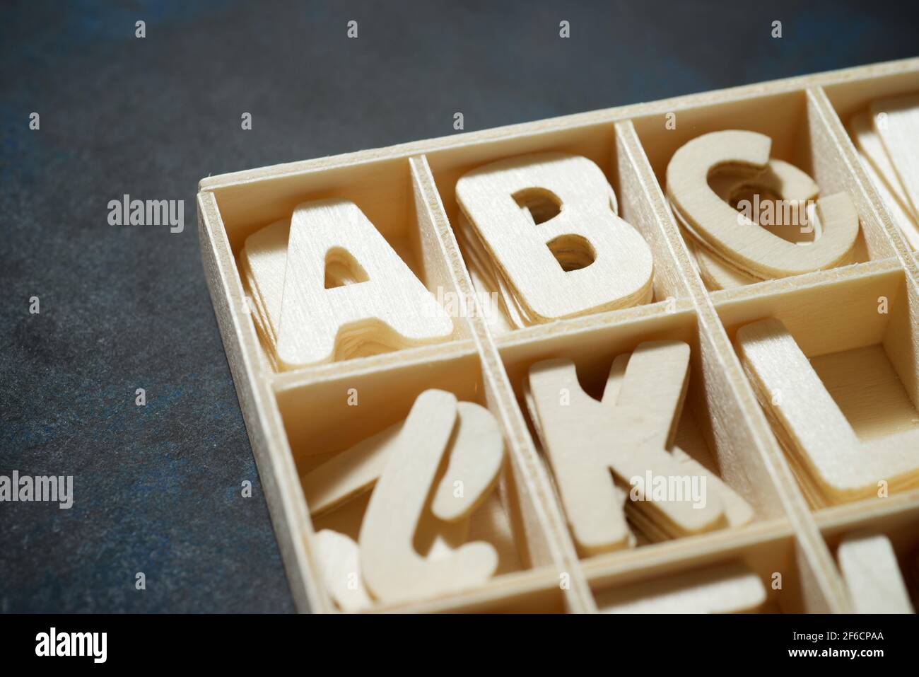 Wood letters in a box Stock Photo - Alamy