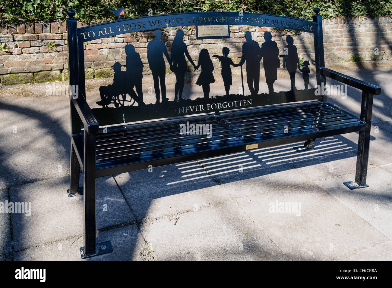 EAST GRINSTEAD, WEST SUSSEX, UK - MARCH 29 : A commemorative bench to Covid 19 victims in East Grinstead, West Sussex on March 29, 2021 Stock Photo