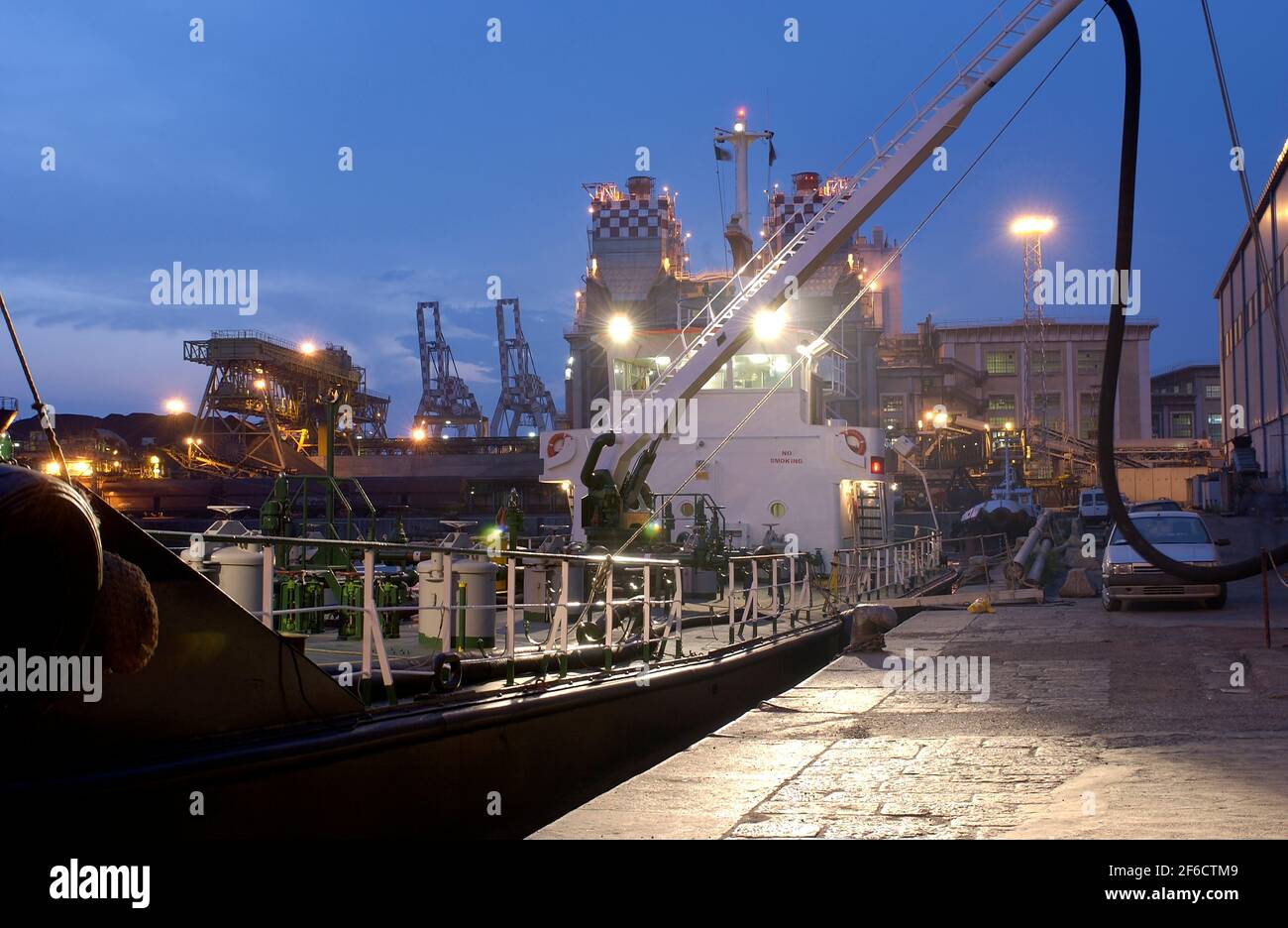 Small ship that loads fuel for the supply of large ships at sea Stock Photo Alamy