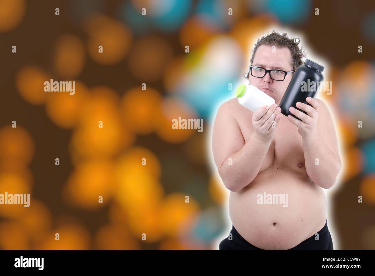 Funny fat guy. Fitness and healthy lifestyle. White background. Stock Photo