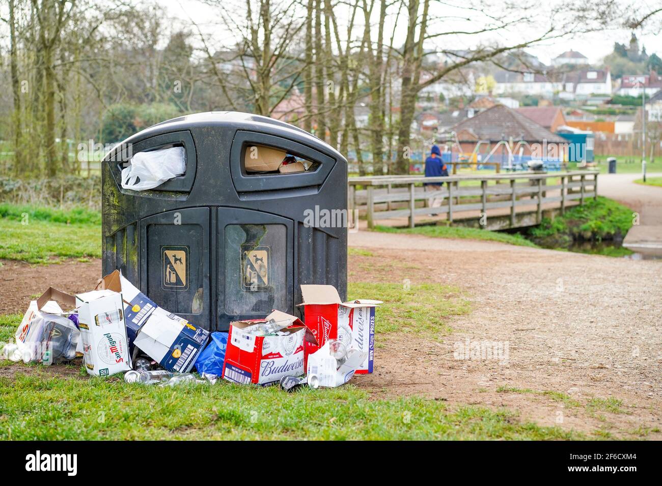 Overflowing public rubbish bin at a park hires stock photography and