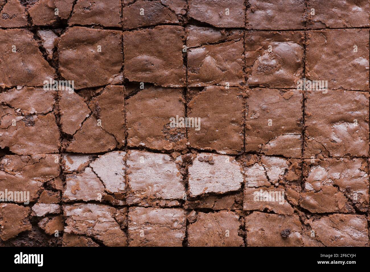 Ready to eat sliced double chocolate brownies hot from oven cut into squares Stock Photo