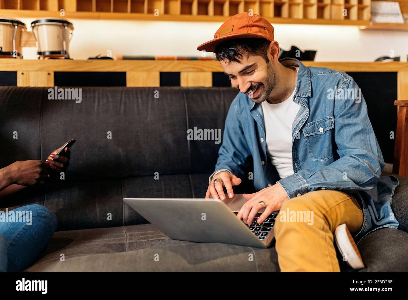 Stock photo of music producer using laptop in the music studio Stock