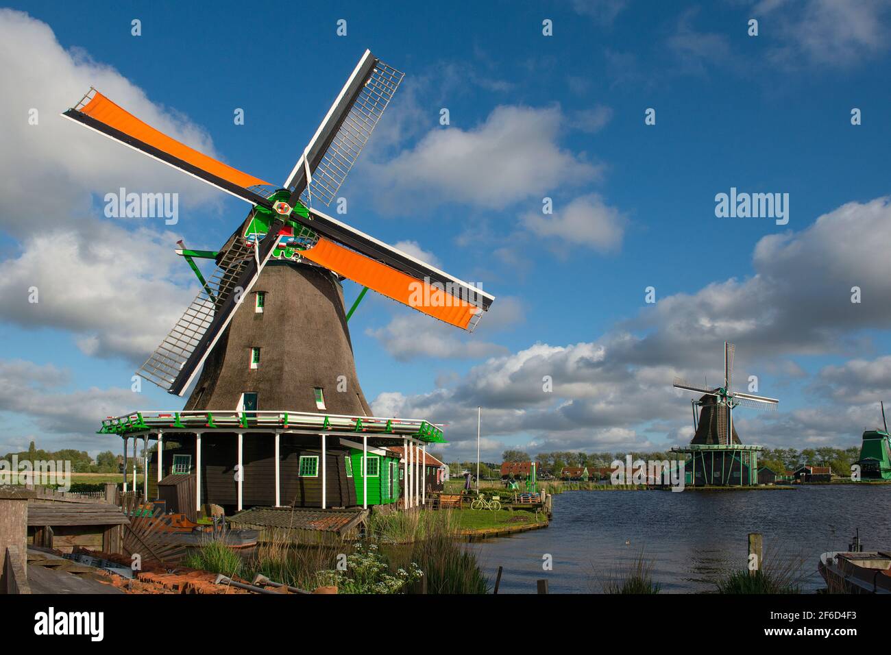 Windmills of the Zaanse Schans a populair historic tourist village in the Netherlands Stock Photo