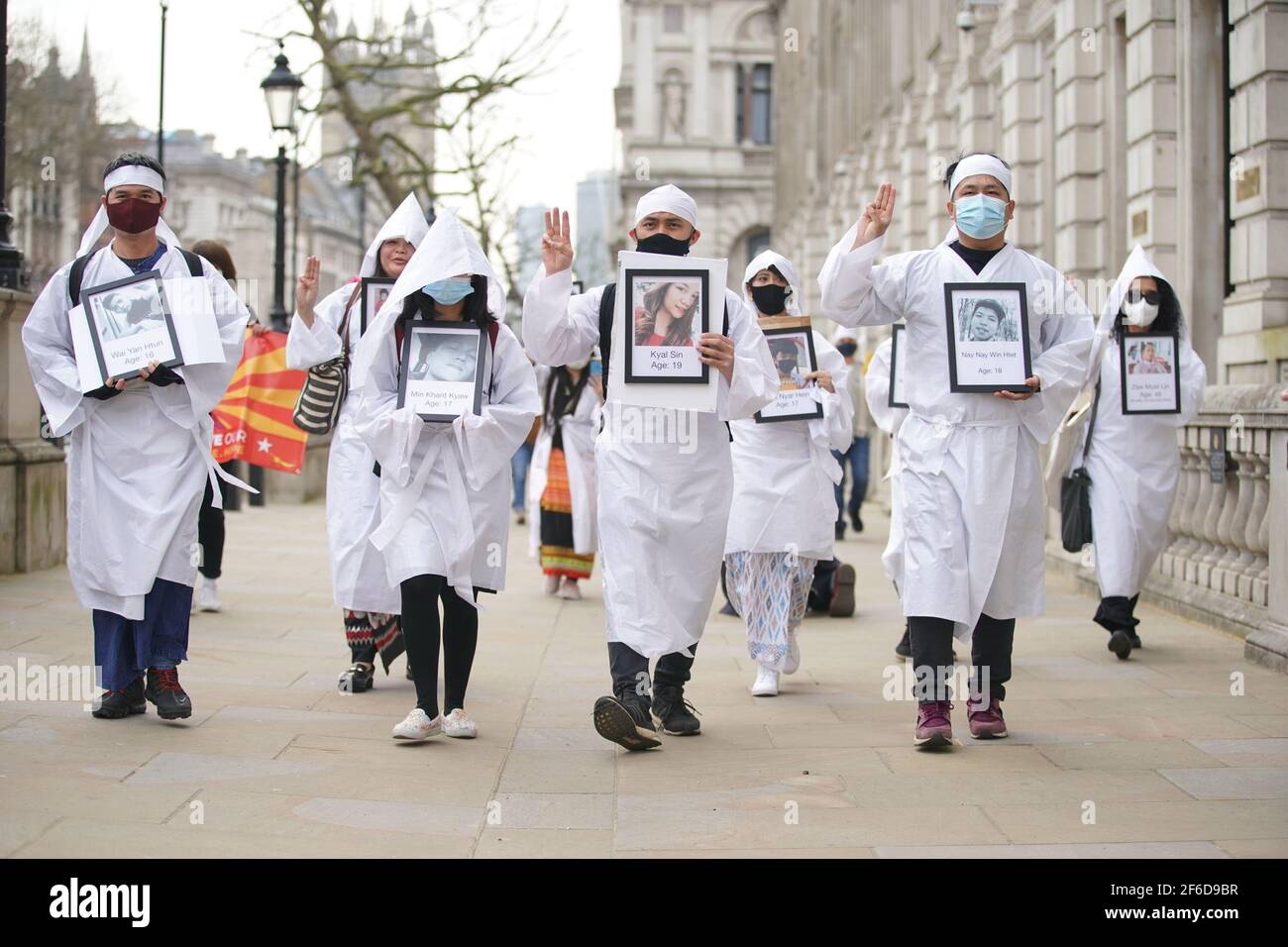 Protesters march in Westminster, central London, demonstrating against the February 1 coup in Myanmar which ousted Aung San Suu Kyi's elected government. Picture date: Wednesday March 31, 2021. Stock Photo