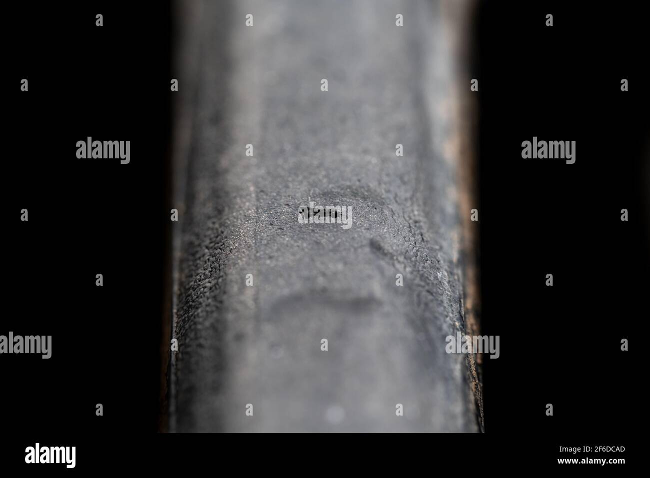 Road cycling tire with deep hole over black Stock Photo