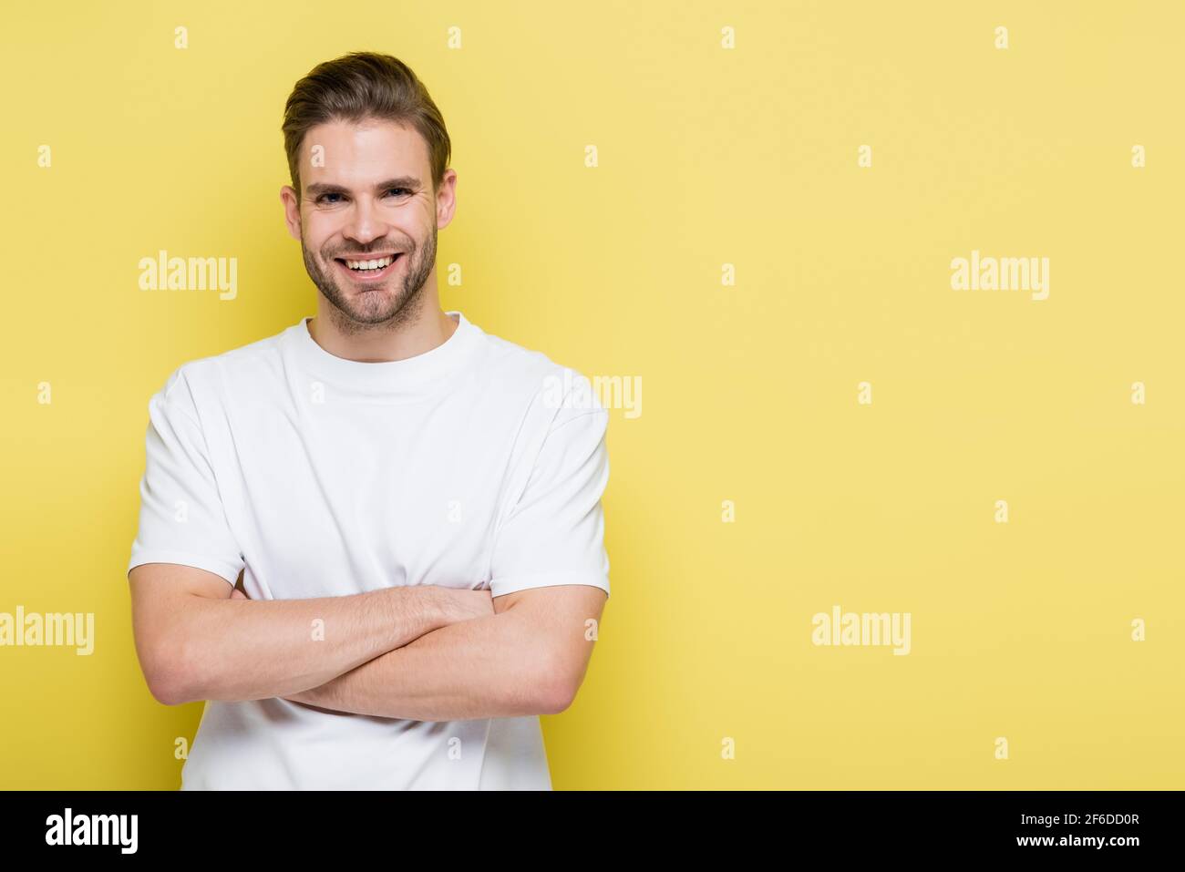 Pleased man crossed arms hi-res stock photography and images - Alamy