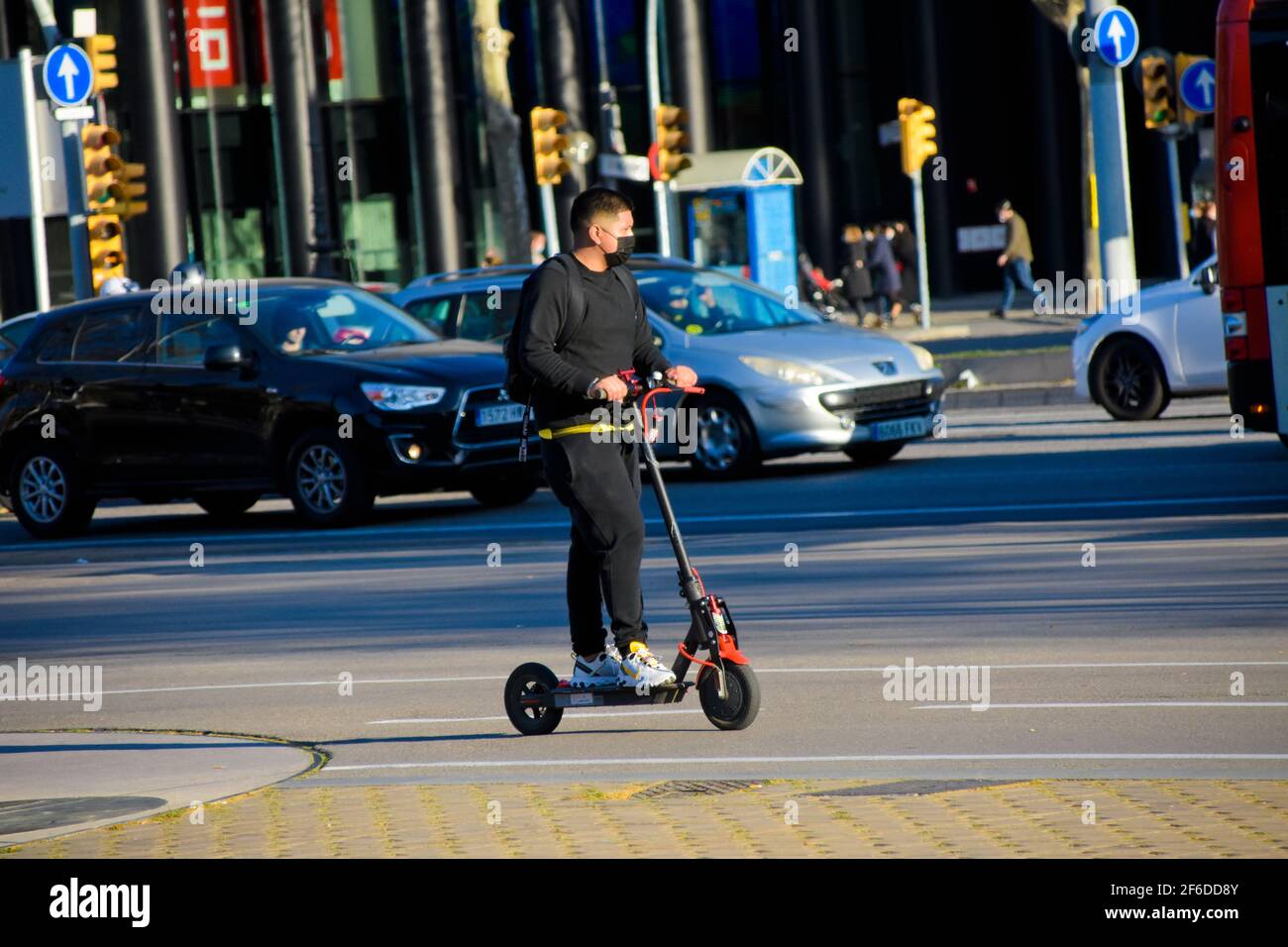 Man in suit on electric scooter hi-res stock photography and images - Alamy