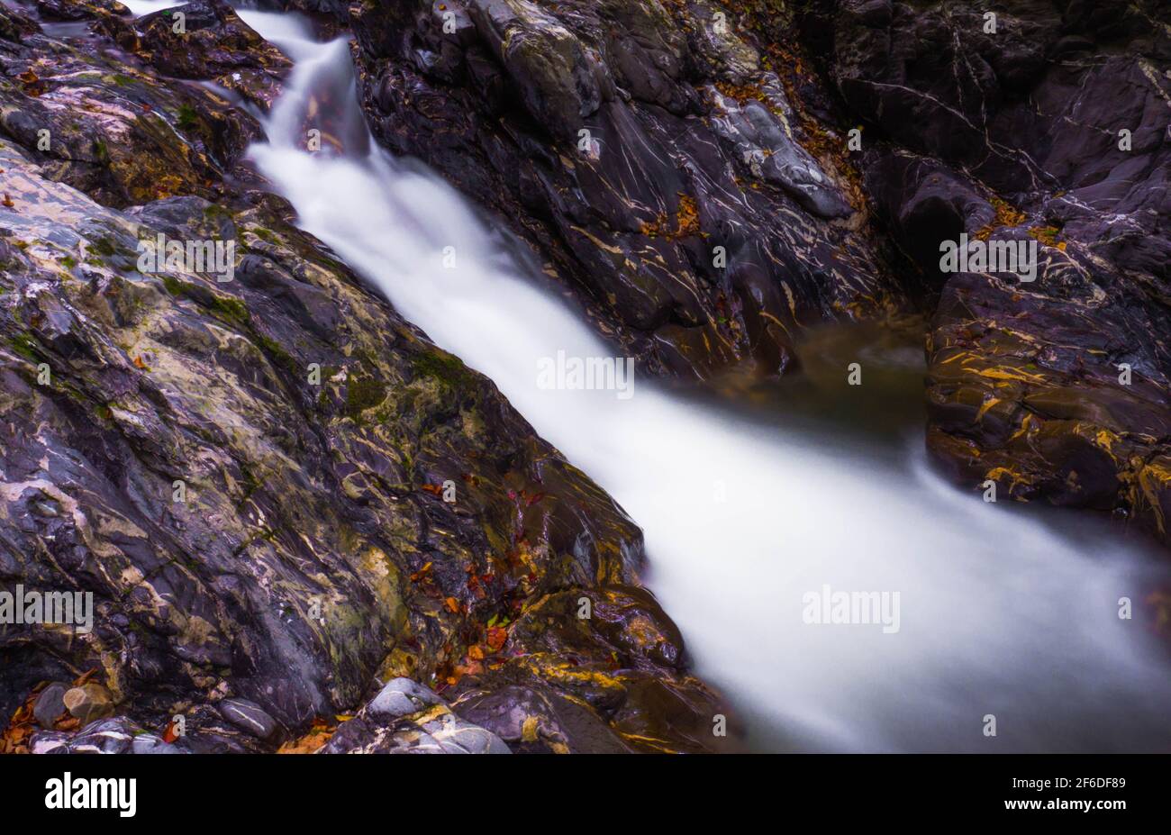 Small waterfall closeup late summer in Romania mountains Stock Photo