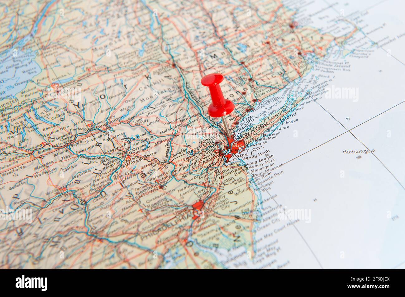 Red pin in a map of the United States pointing out New York as a concept for a desitnation one wishes to go to or has visted already Stock Photo
