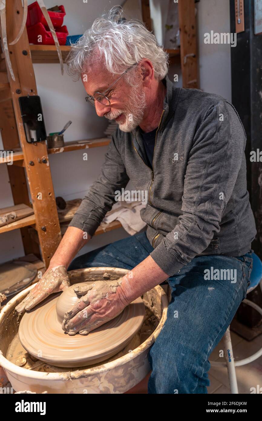 Professional male potter making bowl hi-res stock photography and ...