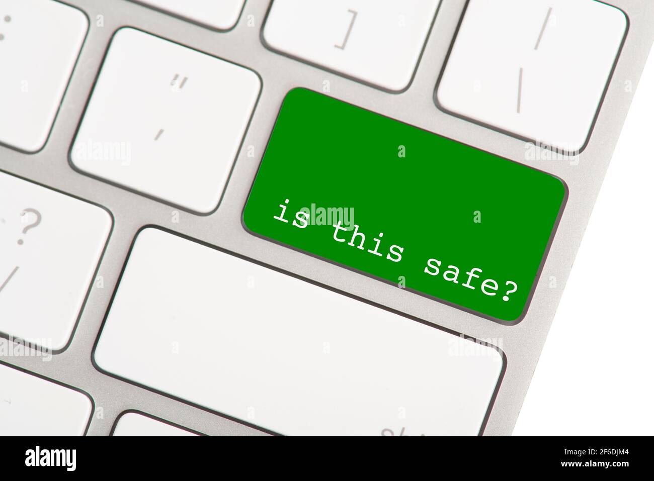 The return button on a computer keyboard colored green, with the question is this safe as a concept for online fraud Stock Photo